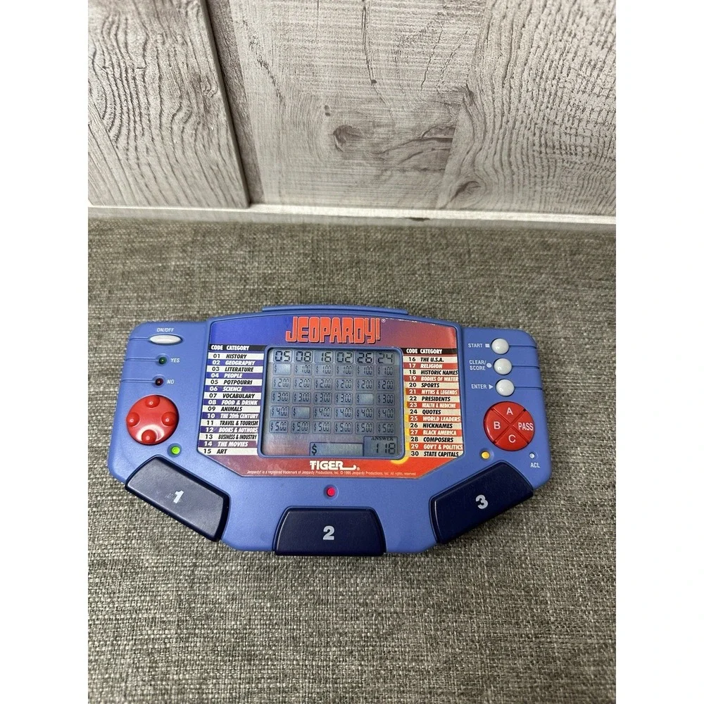 Tiger Jeopardy Handheld Electronic Game w/ 3 Cartridges & Question Answer Books
